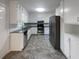 Spacious kitchen with stainless steel appliances and granite countertops and new cabinets at 2067 Wellborn Close, Lithonia, GA 30058