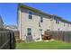 Fenced backyard with a small patio set and green grass at 4925 Longview Walk, Decatur, GA 30035
