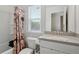 White bathroom with a shower/tub combo, toilet, and zebra-print shower curtain at 4925 Longview Walk, Decatur, GA 30035