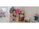 Spacious bedroom with a playroom theme, toy kitchen, and plenty of natural light at 4925 Longview Walk, Decatur, GA 30035