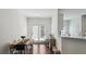 A dining room with access to the backyard, dark floors and seating for six at 4925 Longview Walk, Decatur, GA 30035