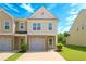 Charming townhouse with a brick facade, one-car garage, well-manicured lawn, and beautiful curb appeal at 4925 Longview Walk, Decatur, GA 30035