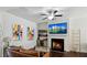 Bright living space features a fireplace, hardwood floors, and open concept living at 4925 Longview Walk, Decatur, GA 30035