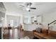 Bright living space features a fireplace, hardwood floors, and open concept living at 4925 Longview Walk, Decatur, GA 30035
