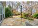 An idyllic outdoor patio area with a gazebo and natural stone pavers provides a perfect space for relaxing at 2410 Emerald Dr, Loganville, GA 30052