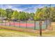 Well-maintained tennis court offers residents an opportunity for recreation and exercise in a beautiful outdoor setting at 2410 Emerald Dr, Loganville, GA 30052