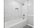Bright bathroom featuring white subway tiles, a sleek shower head, and a built-in alcove at 2930 Parc Lorraine, Lithonia, GA 30038