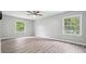 Bedroom featuring wood flooring, ceiling fan, and windows at 2930 Parc Lorraine, Lithonia, GA 30038