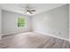Bright bedroom with hardwood floors, a ceiling fan, and windows at 2930 Parc Lorraine, Lithonia, GA 30038