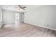 Bedroom featuring wood flooring, fan, and entry to the bathroom at 2930 Parc Lorraine, Lithonia, GA 30038