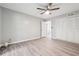 Bright bedroom with wood floors, ceiling fan and large closet doors at 2930 Parc Lorraine, Lithonia, GA 30038