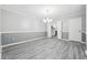 Dining room with modern flooring, fresh paint, and access to the kitchen at 2930 Parc Lorraine, Lithonia, GA 30038