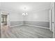 Dining area featuring modern flooring, fresh wall paint, and an elegant chandelier at 2930 Parc Lorraine, Lithonia, GA 30038