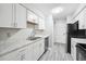 Bright kitchen featuring white cabinets, stainless steel appliances and countertops at 2930 Parc Lorraine, Lithonia, GA 30038