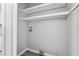 Laundry closet space featuring wood-look flooring and utility connections in a neutral setting at 2930 Parc Lorraine, Lithonia, GA 30038