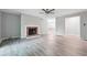 Spacious living room featuring modern flooring, fireplace, and neutral wall paint at 2930 Parc Lorraine, Lithonia, GA 30038