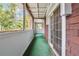 Enclosed porch area with tile accents, outdoor view, and seamless indoor-outdoor transition at 2930 Parc Lorraine, Lithonia, GA 30038