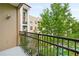 Outdoor balcony with wrought iron railing overlooking greenery at 390 17Th Nw St # 5008, Atlanta, GA 30363