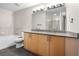 Bathroom with double vanity, granite countertops, and tile flooring at 390 17Th Nw St # 5008, Atlanta, GA 30363
