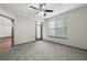 Bright bedroom featuring carpet and door to the outdoor balcony at 390 17Th Nw St # 5008, Atlanta, GA 30363