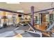 Well-equipped fitness center with treadmills, elliptical machines, weights, and glass enclosed room at 390 17Th Nw St # 5008, Atlanta, GA 30363
