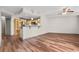 Open living area with wood floors and view of the modern kitchen with a breakfast bar at 390 17Th Nw St # 5008, Atlanta, GA 30363
