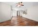 Bright, open-concept living room featuring hardwood floors and modern ceiling fan at 390 17Th Nw St # 5008, Atlanta, GA 30363