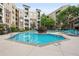 Beautiful community swimming pool with comfortable lounge chairs and well-maintained landscaping at 390 17Th Nw St # 5008, Atlanta, GA 30363