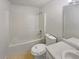 Compact bathroom with a shower-tub combo, and modern fixtures, designed for efficient use of space at 156 Hawthorn Dr, Carrollton, GA 30116