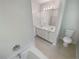 Bright bathroom featuring a double vanity and tile flooring, providing a clean and functional space at 156 Hawthorn Dr, Carrollton, GA 30116