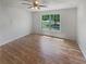 Bedroom featuring wood-look flooring, a ceiling fan, and a window with natural lighting at 156 Hawthorn Dr, Carrollton, GA 30116