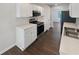 Well-equipped kitchen featuring stainless steel appliances, quartz countertops, and plenty of cabinet space for storage and organization at 156 Hawthorn Dr, Carrollton, GA 30116