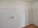 The laundry room contains shelving and hookups at 156 Hawthorn Dr, Carrollton, GA 30116