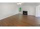 Inviting living room featuring a fireplace, hardwood floors, ample natural light, and a neutral color palette at 156 Hawthorn Dr, Carrollton, GA 30116