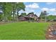 Expansive backyard with mature trees and lush landscaping at 2272 Plantation Ct, Lawrenceville, GA 30044