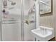 Compact bathroom featuring a sink and shower with frosted glass door at 2272 Plantation Ct, Lawrenceville, GA 30044
