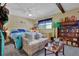 Inviting bedroom featuring a daybed, ceiling fan, natural light, and curated decor creating a personal space at 2272 Plantation Ct, Lawrenceville, GA 30044