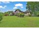 Exterior view of a well-manicured lawn, shrubbery and the front of the house at 2272 Plantation Ct, Lawrenceville, GA 30044