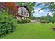 Traditional two-story home with a lush green lawn and beautiful landscaping at 2272 Plantation Ct, Lawrenceville, GA 30044