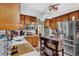 Well-equipped kitchen with stainless steel appliances, ample counter space, and wooden cabinets at 2272 Plantation Ct, Lawrenceville, GA 30044