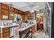 Bright kitchen with stainless steel appliances, a center island, and open view to the dining area at 2272 Plantation Ct, Lawrenceville, GA 30044