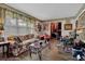 Cozy living room with floral patterned sofa, large window with sheer curtains, and charming decor at 2272 Plantation Ct, Lawrenceville, GA 30044