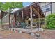 Covered patio with stone flooring, seating area and view of the backyard at 2272 Plantation Ct, Lawrenceville, GA 30044