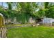 Secluded backyard with stone wall, storage shed, and green grass at 509 Rankin Ne St, Atlanta, GA 30308