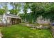Charming backyard with stone wall, seating area, and green grass at 509 Rankin Ne St, Atlanta, GA 30308