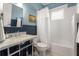 Charming bathroom featuring a marble vanity, wainscoting, and subway tile shower at 509 Rankin Ne St, Atlanta, GA 30308
