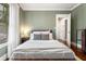 Calm bedroom with natural light, hardwood floors, neutral colors, and a comfortable setting at 509 Rankin Ne St, Atlanta, GA 30308