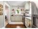 Well-lit, classic kitchen featuring granite countertops, stainless steel appliances, and sage green cabinetry at 509 Rankin Ne St, Atlanta, GA 30308