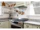 Charming kitchen with granite countertops, stainless steel appliances, and floating corner shelves at 509 Rankin Ne St, Atlanta, GA 30308
