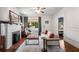 Bright living room featuring a decorative fireplace, hardwood floors, and comfortable seating arrangement at 509 Rankin Ne St, Atlanta, GA 30308